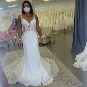 Wedding dress & veil. Never worn.